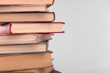Heap of books on grey background
