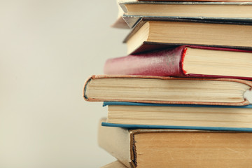 Heap of books on grey background