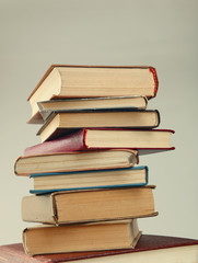 Heap of books on grey background