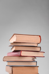 Heap of books on grey background