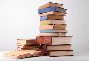 Heap of books on grey background