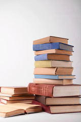 Heap of books on grey background