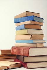 Heap of books on grey background