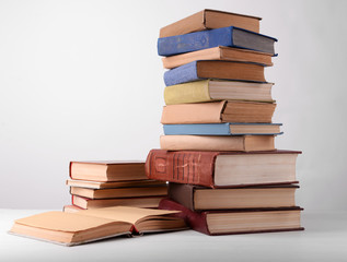 Heap of books on grey background