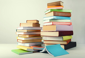 Heap of books on grey background