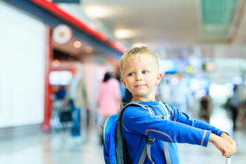 little boy with suitcase travel in the airport