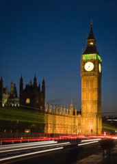 Fototapeta na wymiar Big Ben, London. Long exposure, night view of the iconic London landmark with traffic streaming by.