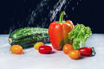 still life with vegetables and water