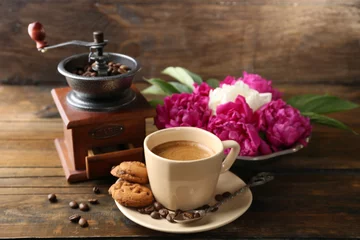 Papier Peint photo autocollant Bar a café Composition with, coffee grinder, cup of coffee and peony flowers on wooden background
