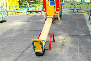 Empty seesaw on playground in public park