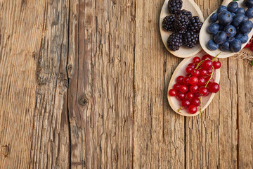 spoons with different berries