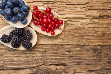 spoons with different berries