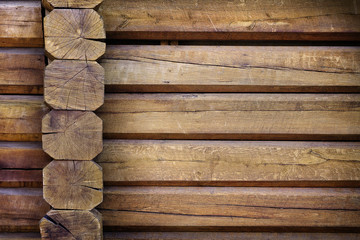 part of a wall of light  wooden huts close up