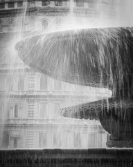 London fountain. Detail of water falling from one of the large fountains found in London's...