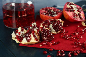 Pomegranate juice with seeds on table, closeup