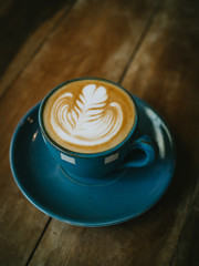 cup of coffee latte on the wood texture