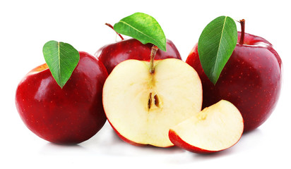 Red apples with leaves and slices isolated on white