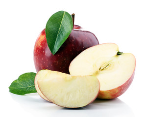 Red apples with leaves and slices isolated on white