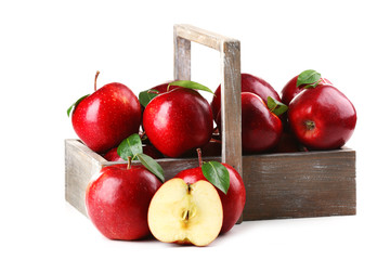 Red apples in wooden crate isolate on white
