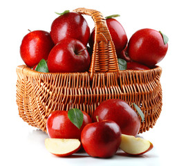 Red apples in wicker basket isolate on white © Africa Studio