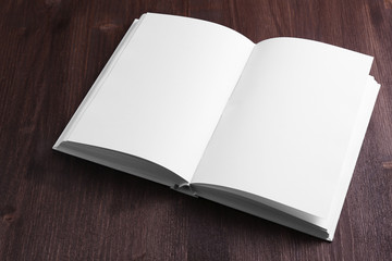 Blank book on wooden background