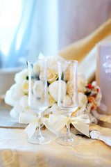 Two glasses and wedding flowers