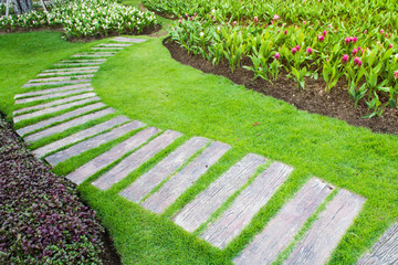 stone walkway in flower garden