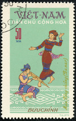  stamp printed in VIETNAM, shows a game instruments and dance
