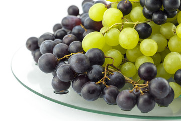 Clusters of grapes on a glass table