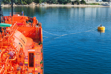 Fototapeta na wymiar Red Liquefied Petroleum Gas tanker in port