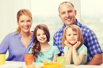 happy family with two kids with having breakfast