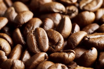 Macro shot of coffee roasted beans background