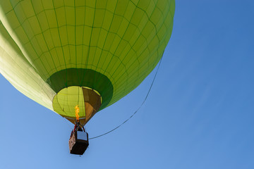 Hot air balloon flight view from below in the blue sky