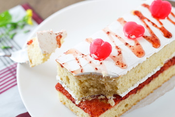 Strawberry cake with heart candies for sweet valentines.
