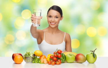 happy woman with healthy food showing water glass