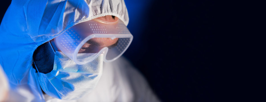 Close Up Of Scientist Face In Chemical Lab