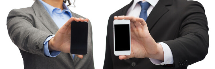 businessman and businesswoman with smartphones