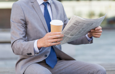 close up of businessman reading newspaper