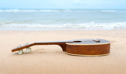 Fototapeta na wymiar ukulele on the beach