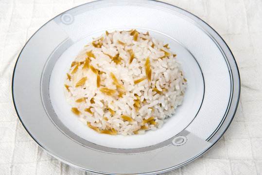 Turkish traditional meal, beans, rice, mixed pickles and tzatziki