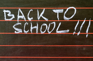 Back to school written on blackboard.