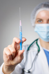 Female doctor with syringe