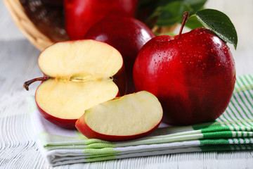 Ripe red apples on table close up