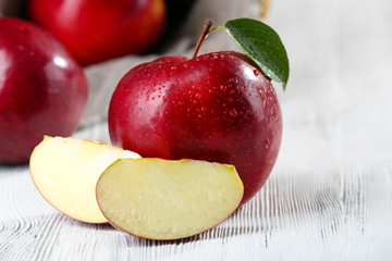 Ripe red apples on table close up