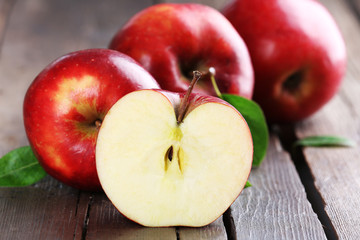Ripe red apples on table close up