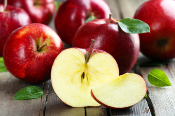 Ripe red apples on table close up