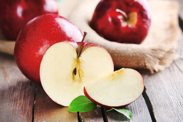 Ripe red apples on table close up
