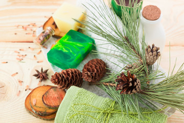 towel, candle and handmade soap on wooden