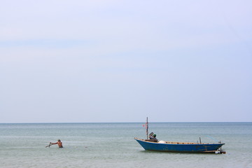 Naklejka na ściany i meble fisherman sunrise Ships and boat on the beach