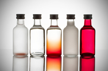 Back lit collection of colorful glass bottles